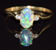 An 18ct gold ring set with an opal and diamonds, 1.4g, size N
