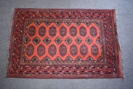 Afghan rug with red ground and geometric borders, 200 x 130cm