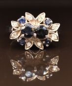 An 18ct white gold ring set with sapphires and diamonds, 4.4g, size P