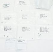 Sixty four loose diamonds including green and blue, the largest 0.1ct