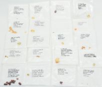 Twenty eight loose garnets, twenty eight loose citrines, one loose chrysoberyl and one loose