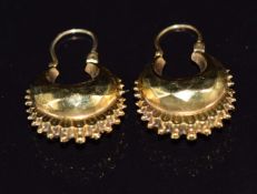 A pair of 9ct gold earrings with faceted decoration, 1.8g