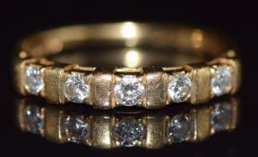 An 18ct gold half eternity ring set with diamonds, each approximately 0.06ct, 2.5g, size L