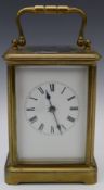 Brass cased carriage clock with white enamel dial and two train movement striking on a gong, H17.