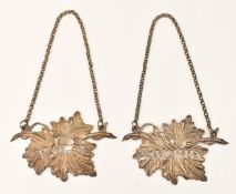 Pair of William IV silver bottle tickets formed as pierced and embossed leaves, for Sherry and Port,