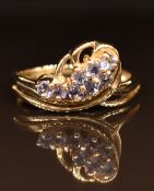 A 9ct gold ring set with tanzanites, 2.4g, size M