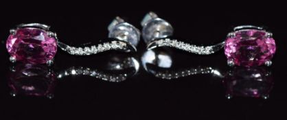 A pair of 9ct white gold earrings set with old cut pink synthetic sapphires and diamonds, 2.5g