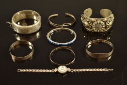 Six silver bangles and a silver watch