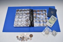 An amateur collection of UK coinage in an album, includes small silver content and a Tredegar £1