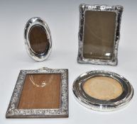 Four hallmarked silver photograph frames comprising two to suit 6 x 4 inch photo, a circular example
