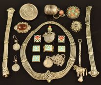 A collection of white metal/ silver jewellery including filigree, Eastern pendants and brooches,