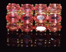 A pair of 18k gold earrings set with Ceylon padparadsha sapphires, 5.8g