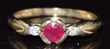 A 9ct gold ring set with ruby and two diamonds,1.9g, size N