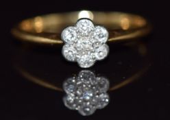 An 18ct gold ring set with diamonds in a flower cluster, 2.3g, size O