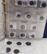 A collection of Roman bronze and some silver coins contained in an album, includes Paduan type,