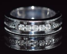 A 9k white gold ring set with diamonds totalling approximately 0.3ct, 6g, size M