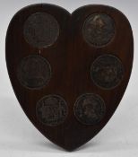Six 8 Reale silver coins, Carolus IV mounted in a wooden heart