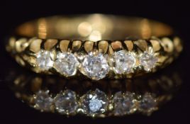 An 18ct gold ring set with five diamonds, Birmingham 1908, 3.7g, size O