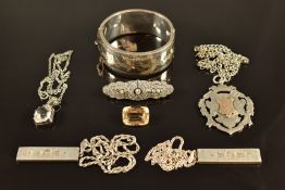 A silver bangle with engraved decoration, a silver fob with applied gold detail, silver watch, two