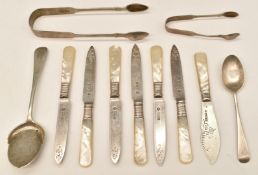 Hallmarked silver cutlery comprising two pair of sugar tongs, jam or similar spoon and a teaspoon,