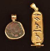An 18k gold Egyptian pendant with Diana in hieroglyphics (2.2g) and a coin in an 18k gold pendant