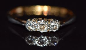 An 18ct gold ring set with three diamonds,1.8g, size K