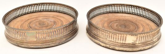 Pair of hallmarked silver bottle or wine coasters with pierced decoration, Sheffield 1911, maker
