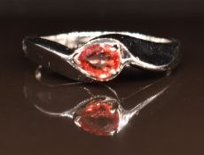 A 9ct white gold ring set with a pear cut orange sapphire, 2.9g, size M