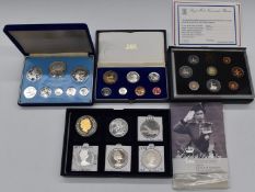 Four various coin sets to include coinage of Belize, silver set for 1983 UK, proof set South