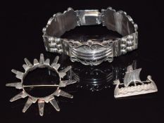 Mexican silver bracelet marked TM. 111, Norwegian silver brooch and a Shetland brooch, Edinburgh