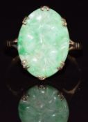 A 9ct gold ring set with carved jade panel, 2.5g, size R