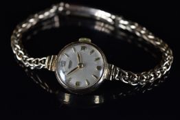 Tissot 9ct gold ladies wristwatch ref. 718.872 with gold hands and hour markers, silver dial and