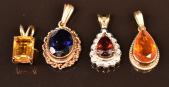 Four 9ct gold pendants comprising one set with fire opal, one garnet and diamonds, one citrine and