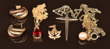 A 9ct gold pendants set with a synthetic ruby and diamonds, on 9ct gold chain, a 9ct gold chain