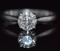 A platinum ring set with a round brilliant cut diamond of approximately 1ct, 3.7g, size J