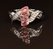 A 9k white gold ring set with Padparadscha sapphires and diamonds, 3.4g, size N