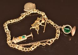 A 9ct gold charm bracelet with four 9ct gold charms 'i love you', golf player, traffic lights and