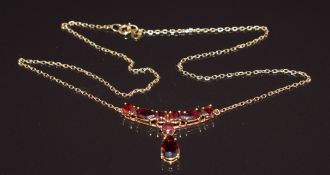 An 18ct gold necklace set with round, marquise and pear cut garnets, 6.2g, 34cm long