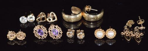 Eight pairs of 9ct gold earrings including amethyst, pearl, etc, 8.9g