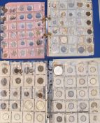 Two Magpie collector's albums containing world coinage to include Tonga, Poland, Philippines, Saudi,