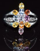 A 9k white gold ring set with multi-coloured sapphires, 4.7g, size M