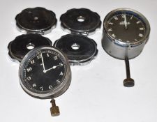 Two wind up car dashboard clocks one by Jaeger the other marked AC, together with four vintage car