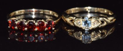 Two 9ct gold rings, one set with garnets and the other aquamarine, 3.7g, size M