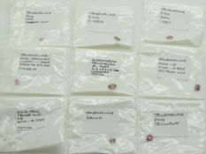 Nine loose pink tourmalines including 1.28ct oval cut, 0.9ct emerald cut, 1ct trilliant cut, etc
