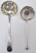 Two hallmarked silver sifter ladles, one Irish, Dublin 1833, maker George Bayly, the other Chester
