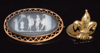A 15ct gold brooch set with a Wedgwood cameo depicting Roman gladiators (3.3cm) and an 18ct gold
