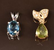A 9k white gold pendant set with an oval cut London blue topaz and a 9k gold pendant set with a pear