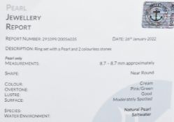 An 18ct white gold ring set with a natural saltwater pearl (8.7mm) in a ridged setting set with