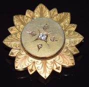 Victorian yellow metal brooch set with an old cut diamond of approximately 0.2ct and four smaller
