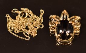 A 9ct gold pendant set with onyx on 9ct gold chain, 3.2g